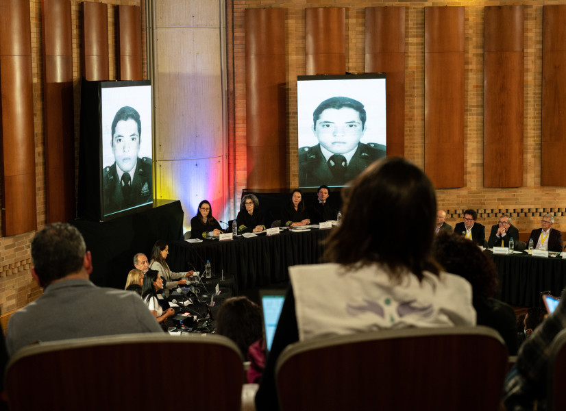 Magistrates of the Special Jurisdiction for Peace and members of the last Secretariat of the FARC guerrilla listen to a victim's intervention as part of the first Acknowledgment Hearing of Macrocase 01