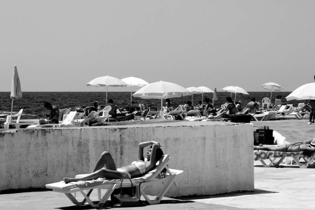 Old photo of people sunbathing on a Lebanese beach